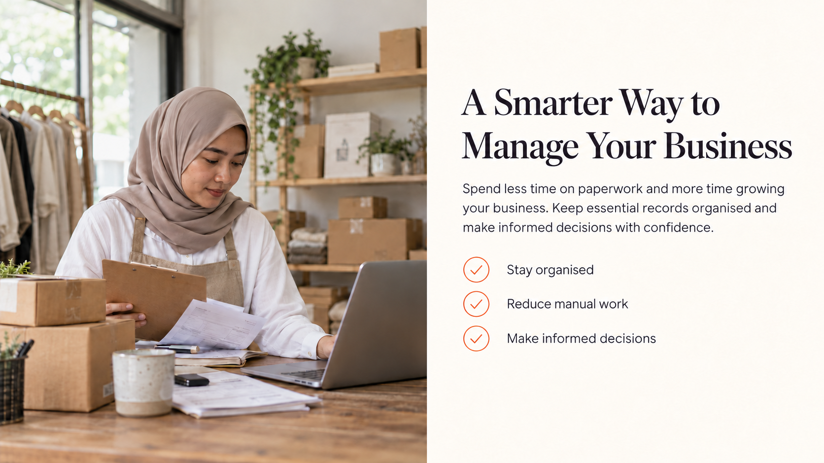 Malay woman entrepreneur wearing a hijab and long sleeves as she manages her shop